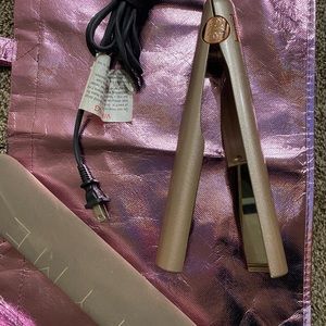 Tyme iron pro. used twice. No box includes heat sleeve. Adjustable temperature